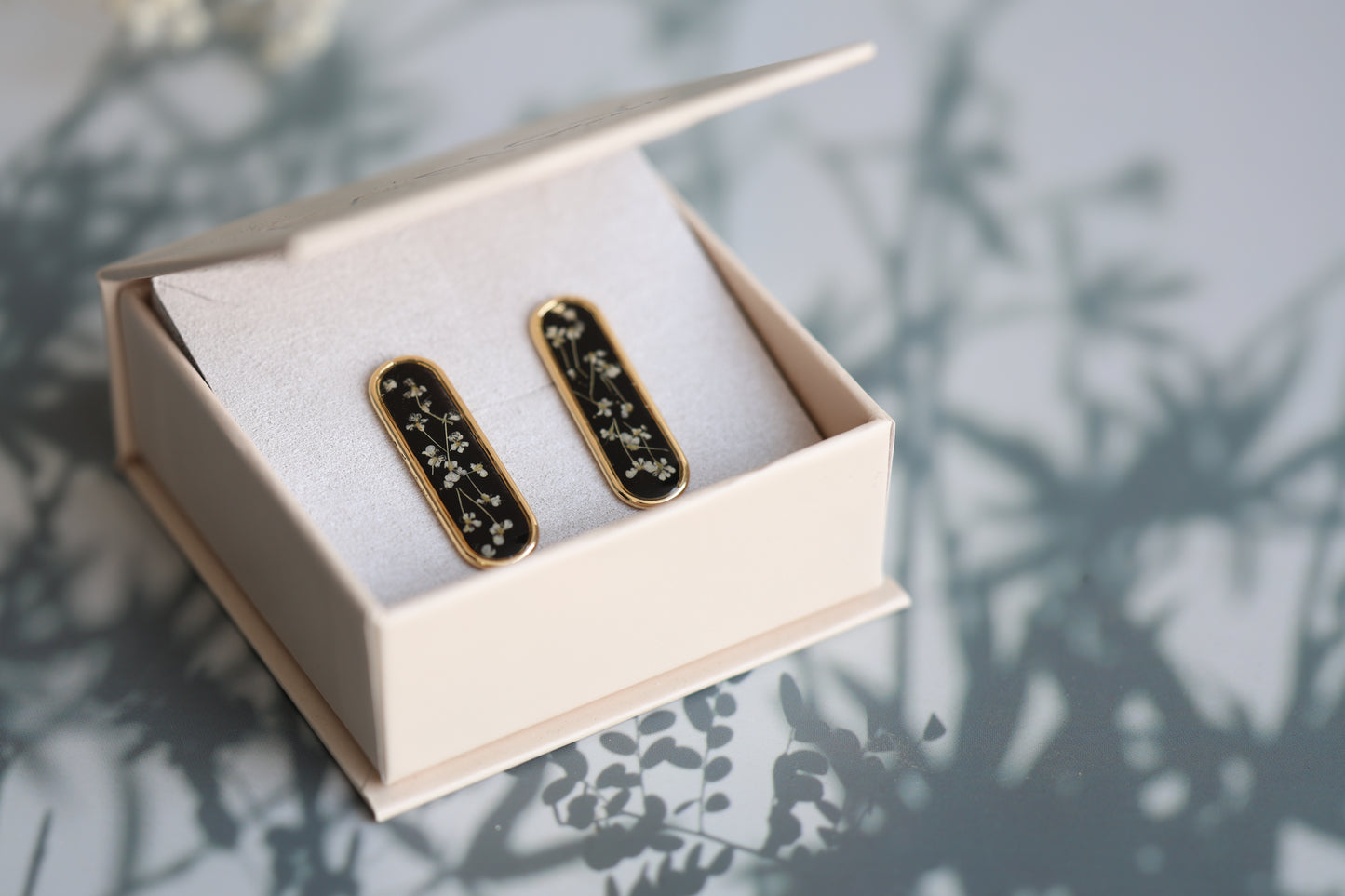 Gold Botanical Earrings on Black Background