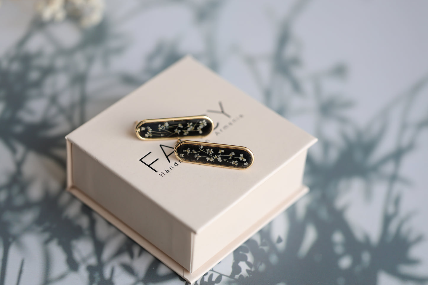 Gold Botanical Earrings on Black Background