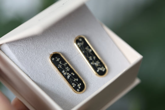 Gold Botanical Earrings on Black Background