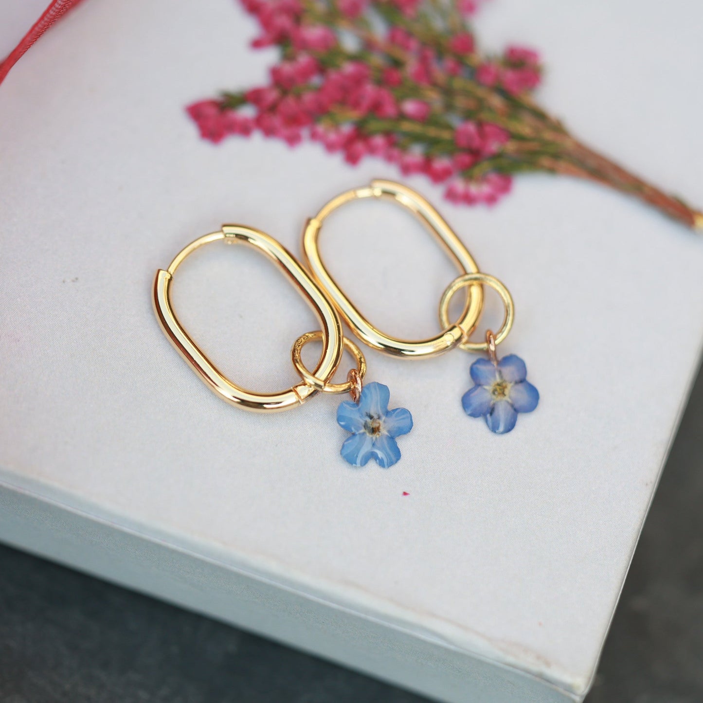 Pressed flower hoop earrings with removable forget me not charm